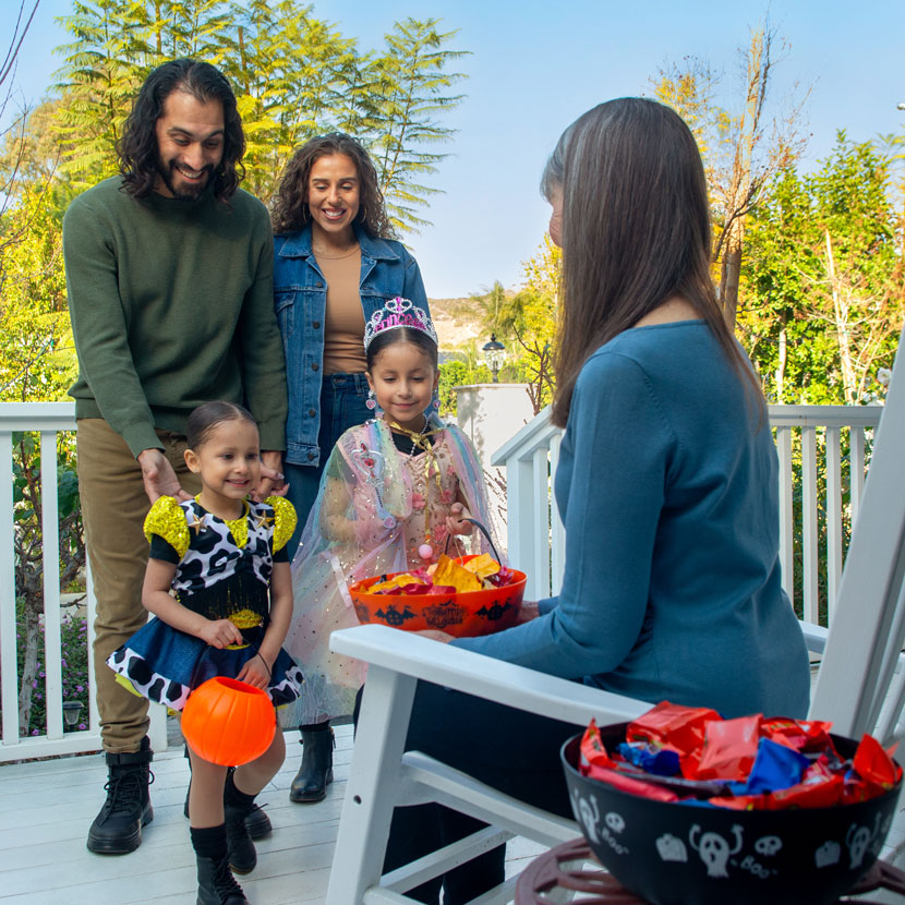 A family smiles with peace because of TruStage debt protection