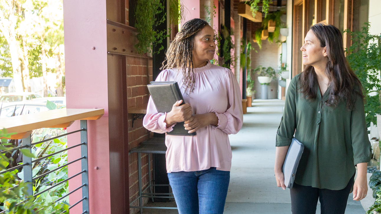 Two employees walking