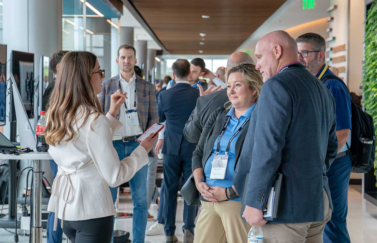 A representative explains TruStage stablecoin features to a group of credit union professionals.