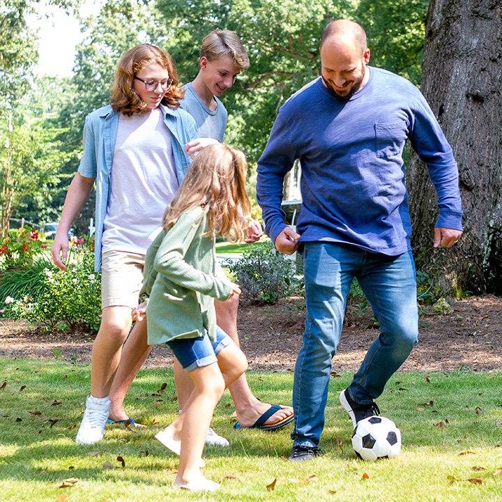 Playing soccer with family while protected with whole life insurance