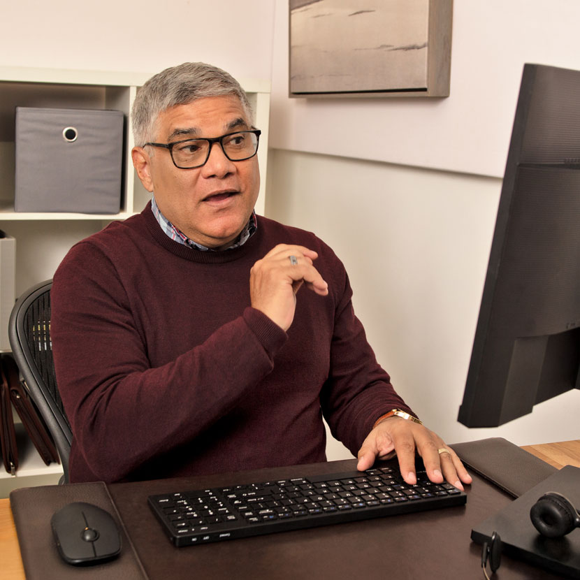 A man reads about TruStage workplace solutions on his computer