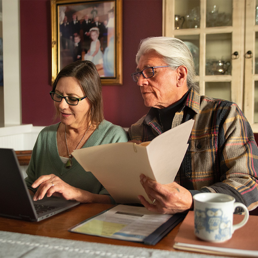 Two people review their TruStage retirement documents